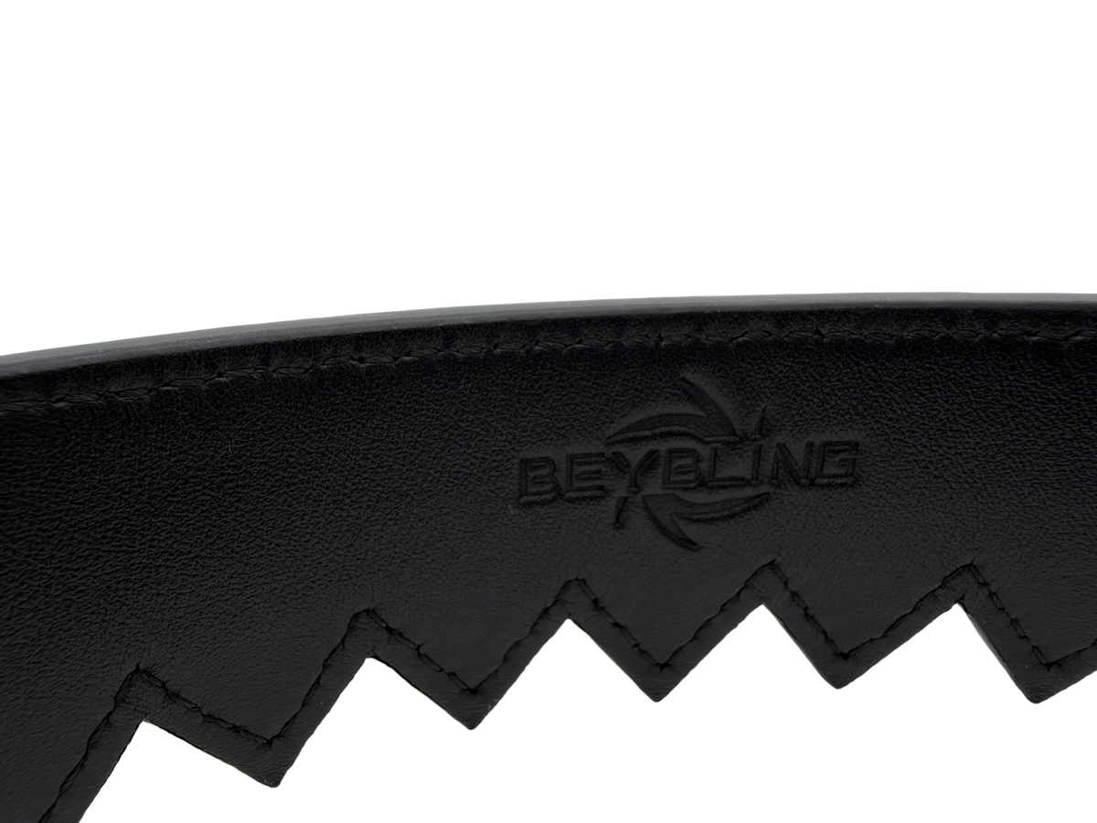 Close-up of the black leather Ripcord Belt with an embossed BeyBling logo above the serrated zigzag edge